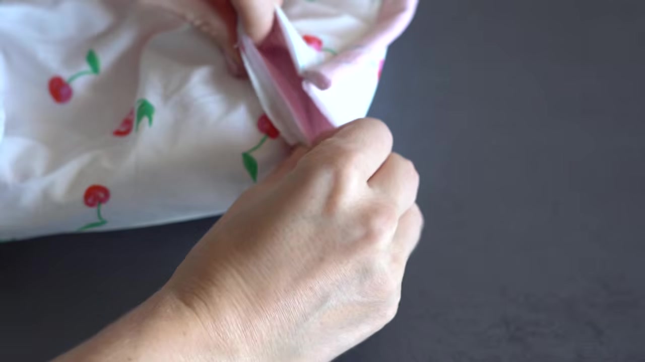 Turning the quilted makeup bag right side out through the lining gap