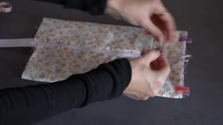 Pinning the zipper to the quilted makeup bag panel before sewing