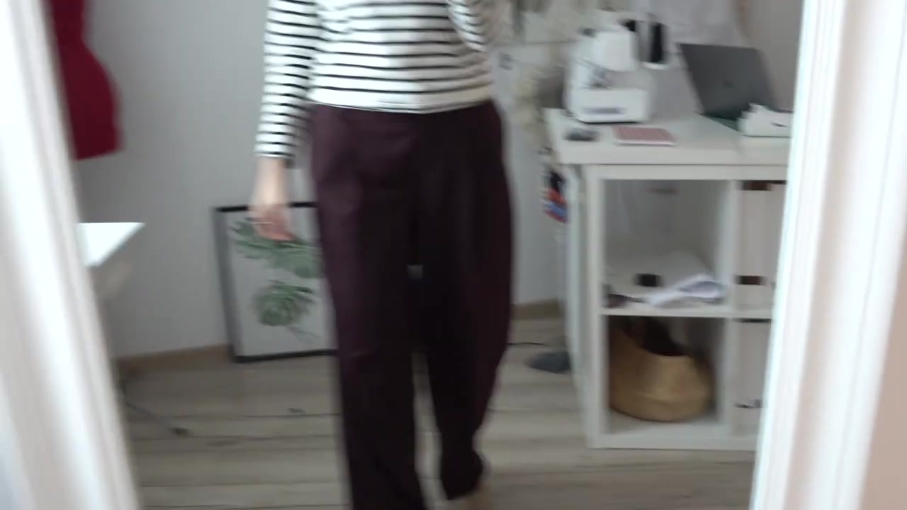Back view showing the drape and movement of wide-leg trousers
