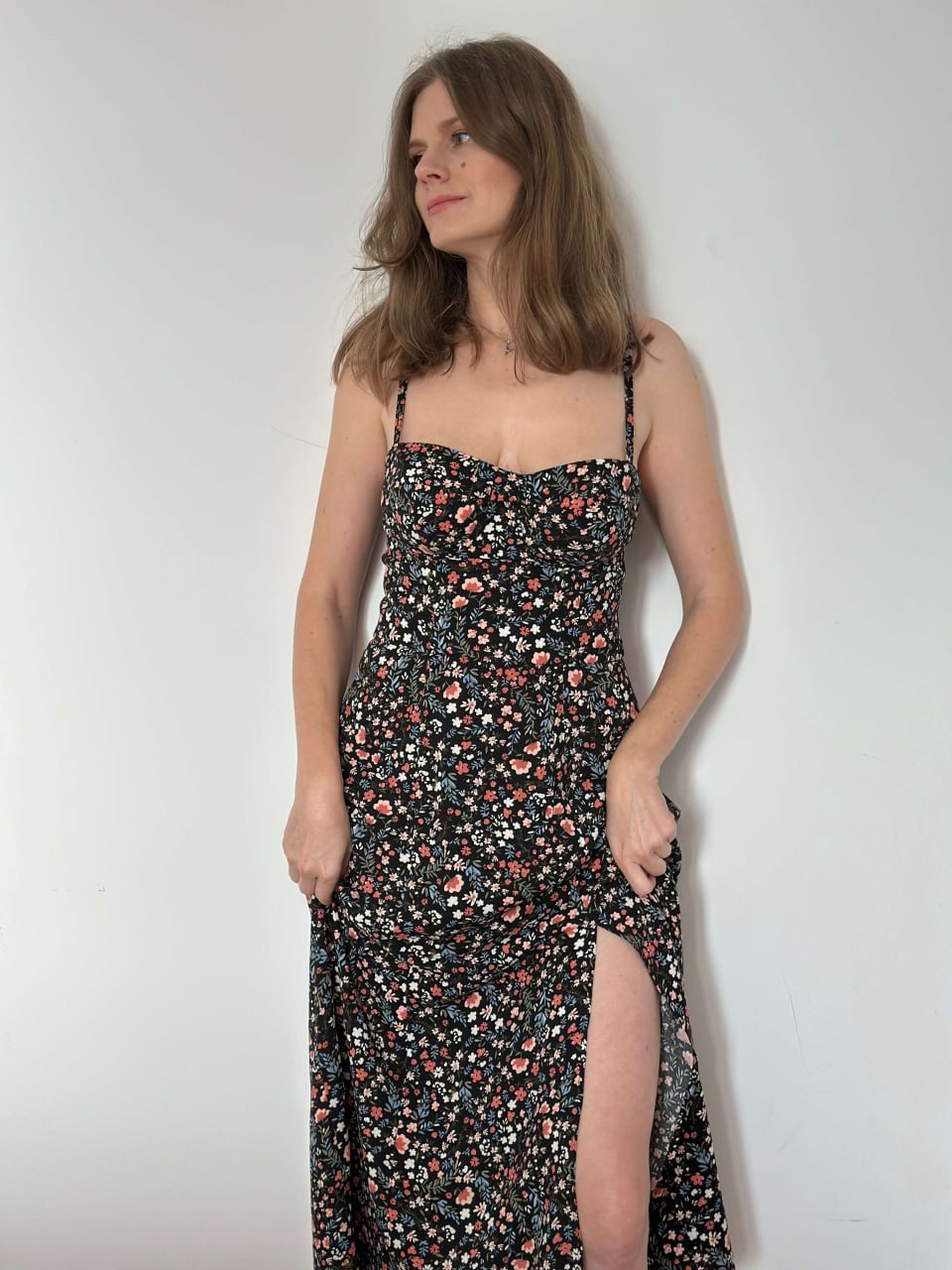 Black floral bustier maxi dress with a high side slit