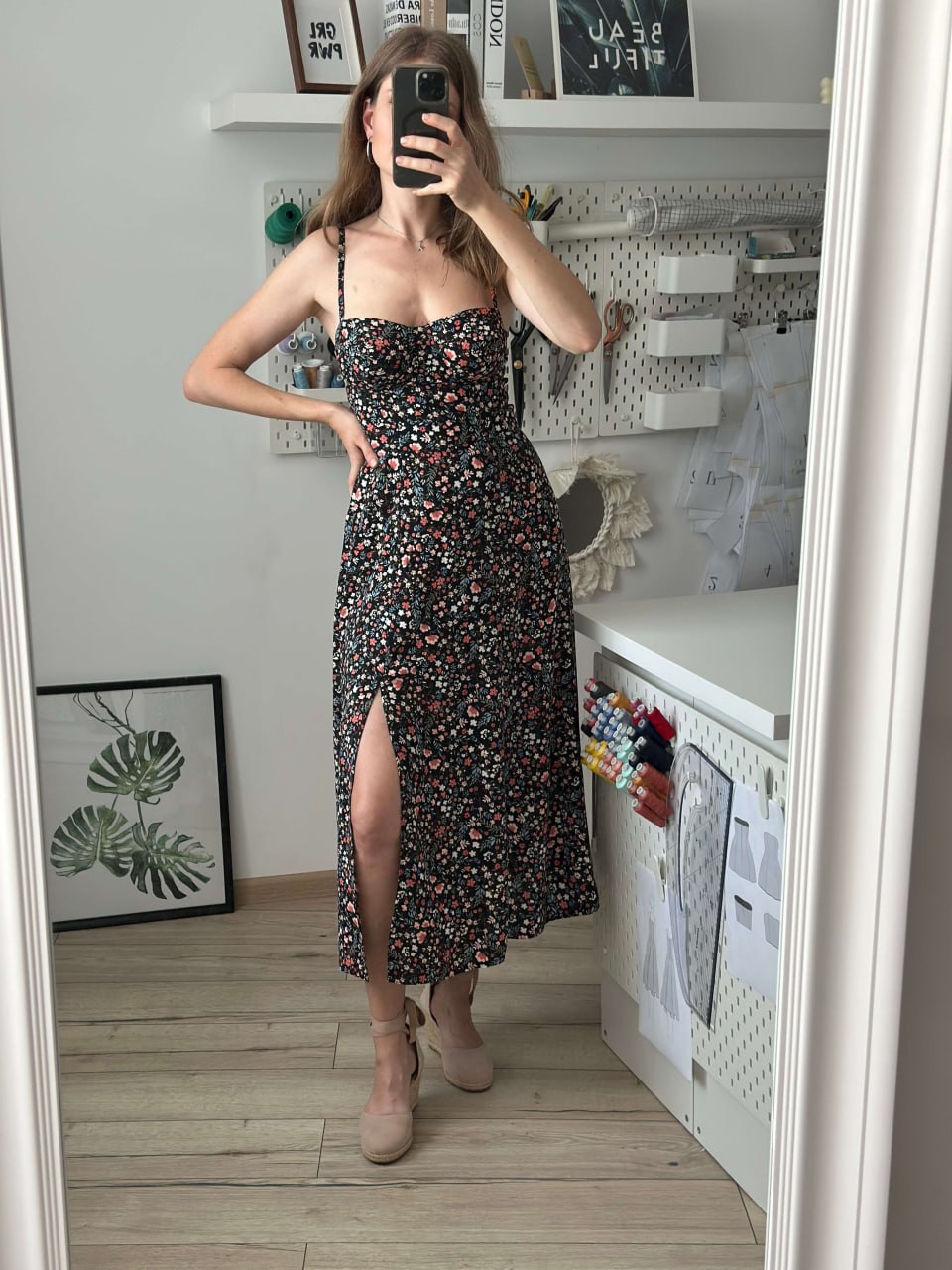 Bustier midi dress worn in the sewing room, showing the slit and gathered skirt
