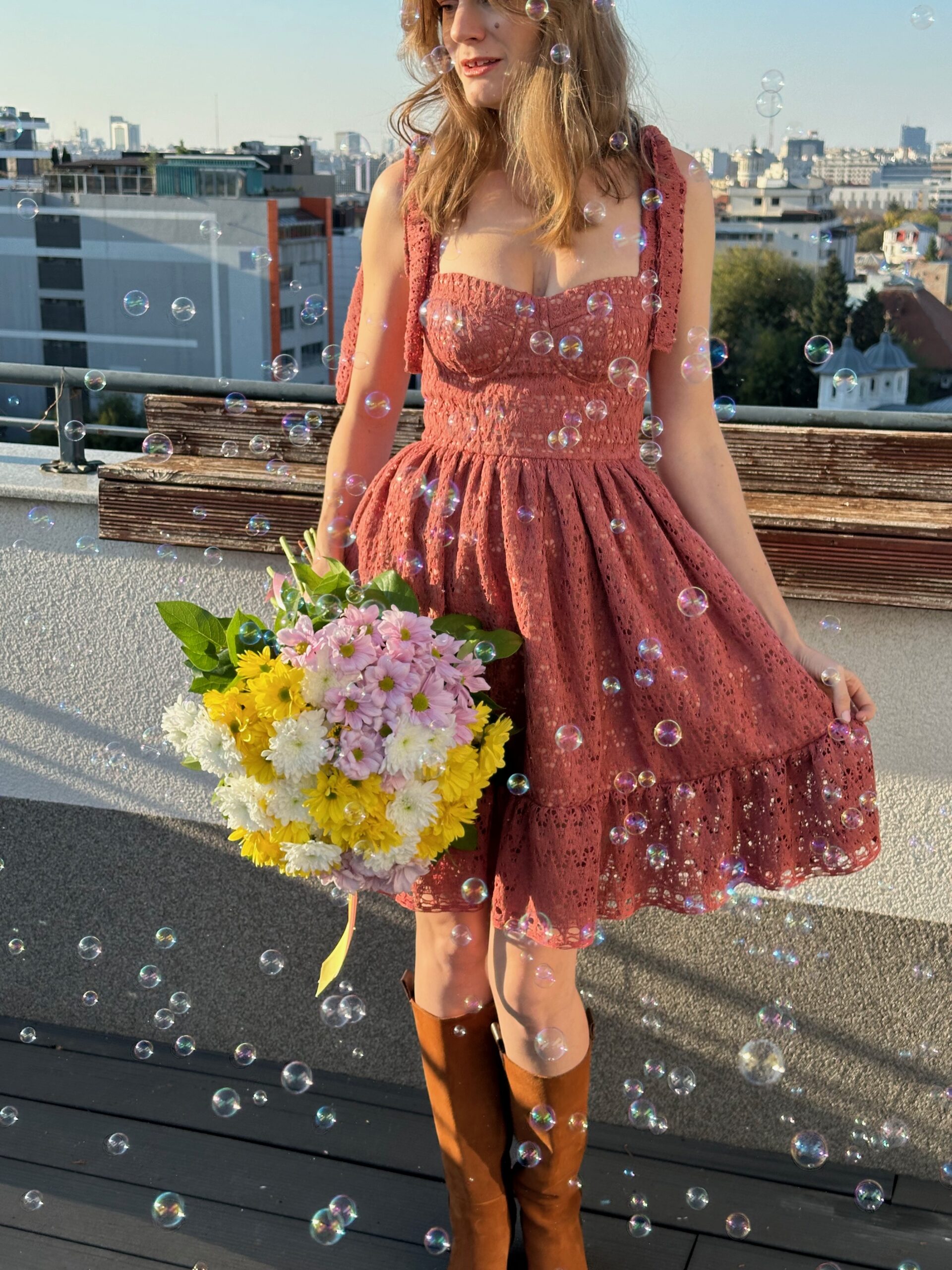 Bustier Dress sewn in red floral print, midi length with a gathered skirt, worn on a city street