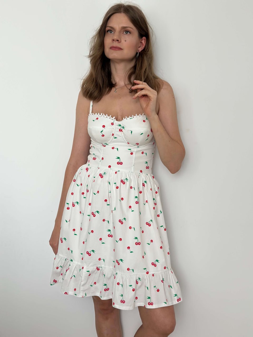 Cherry print bustier dress with a lace-trimmed sweetheart neckline, full length