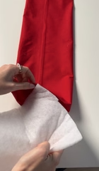 Sliding quilt wadding into the fabric tube that becomes the bow loops