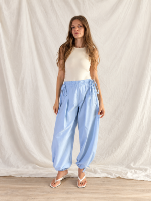 Jasmine balloon pants in light blue, front view showing the elastic waist with ties and the gathered balloon leg