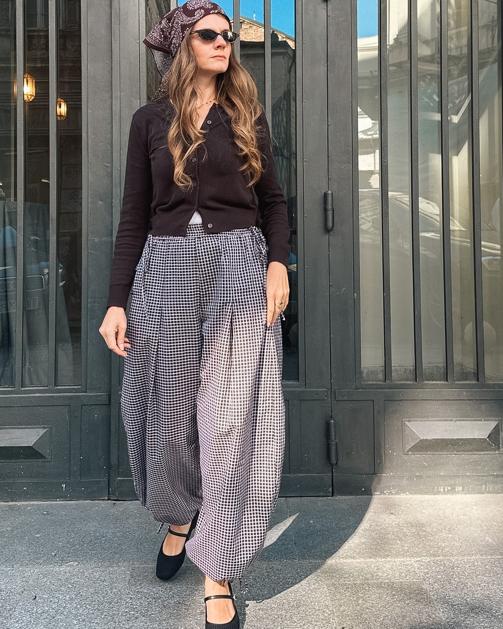 Jasmine balloon pants in gingham, hands in the pockets