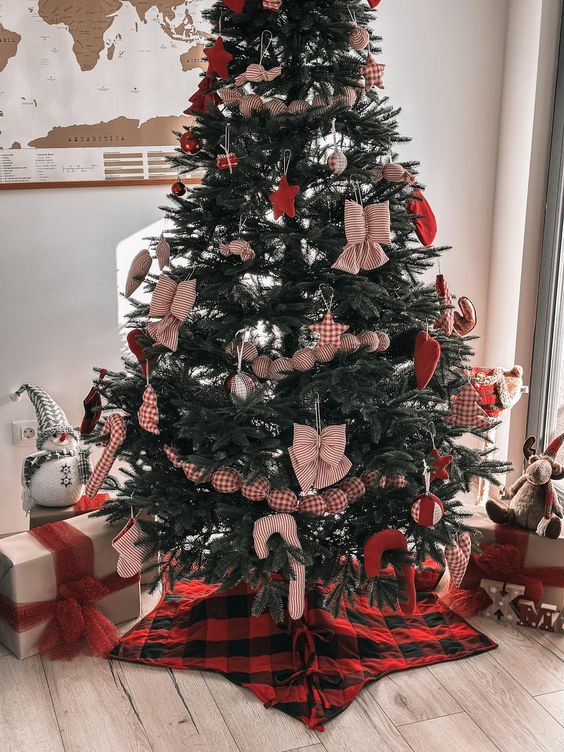 Quilted buffalo check tree skirt styled under a decorated Christmas tree with wrapped gifts