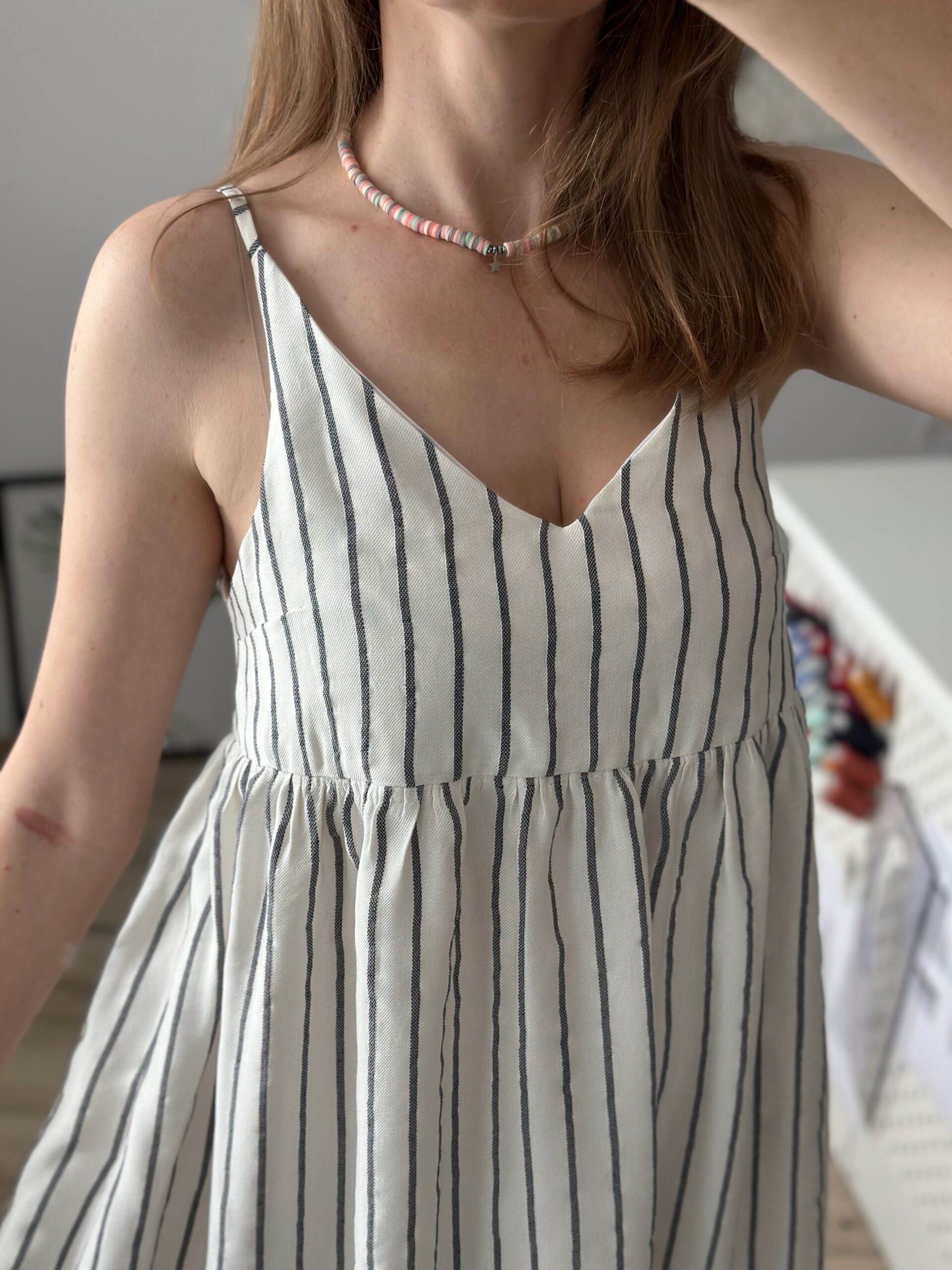 Front view of the sundress bodice with gathered waist and striped fabric