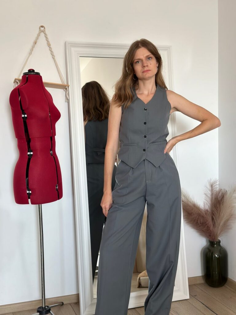 Homemade grey waistcoat worn buttoned with wide-leg trousers
