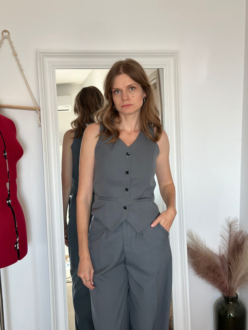 Waistcoat and matching trousers, three-quarter view showing the fit at the waist