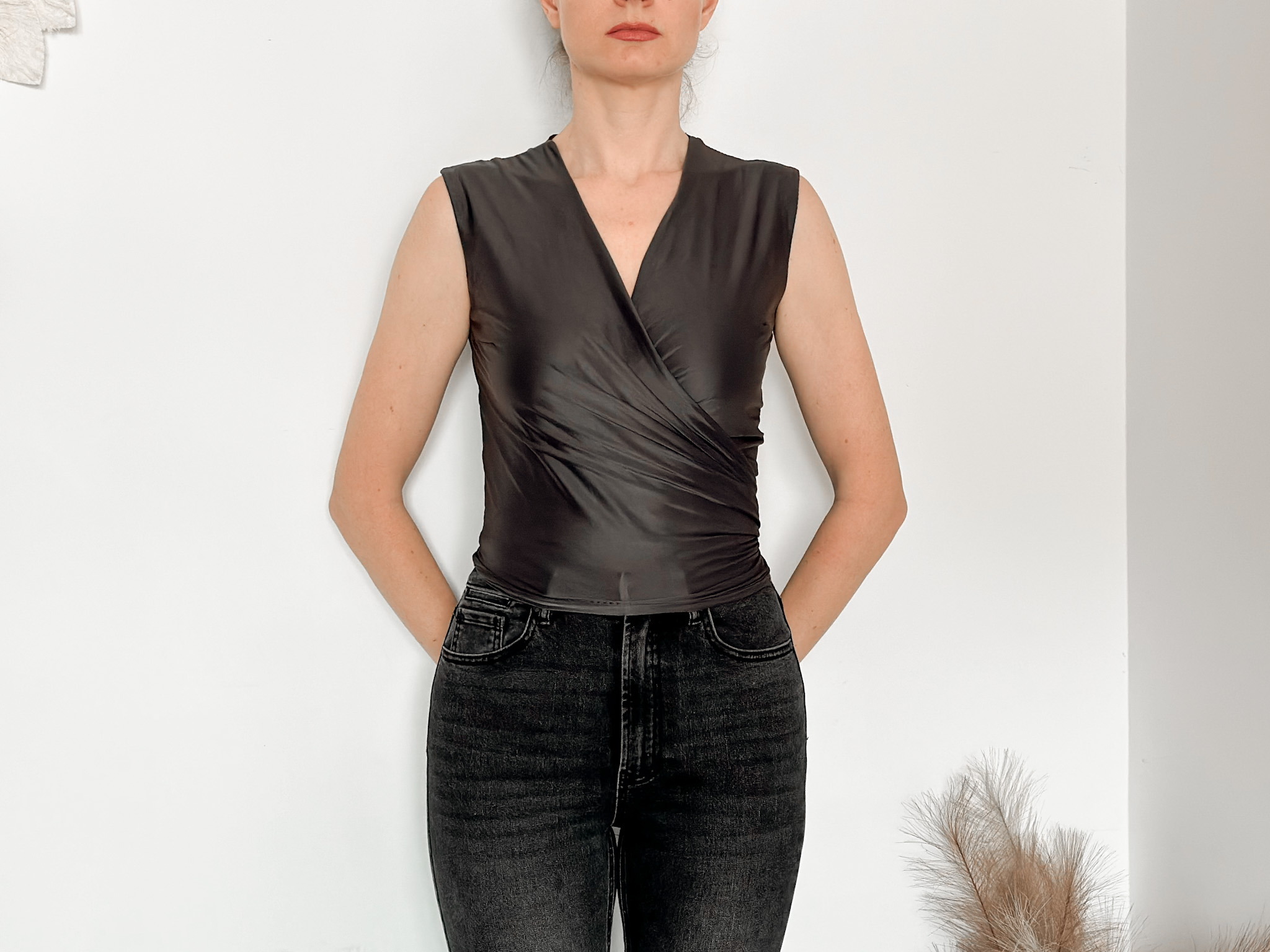 Wrap blouse sewn in black, worn with jeans